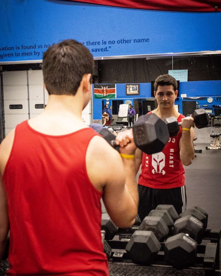 Train. Conquer. Repeat. Tank Top